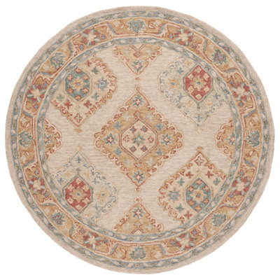 Olavarria Hand Tufted Wool/Cotton Southwestern Rug in Rust/Beige