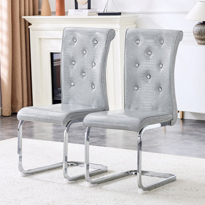 Ensemble de 4 chaises de salle à manger en peau d'alligator rétro avec boucles en cristal et pieds en métal galvanisé pour une assise élégante.