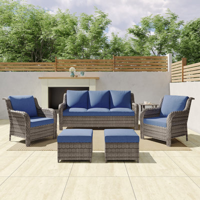 A Three-Seater Sofa + Two Armchairs + Two Footstools