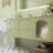 Simple green bathroom cabinet.