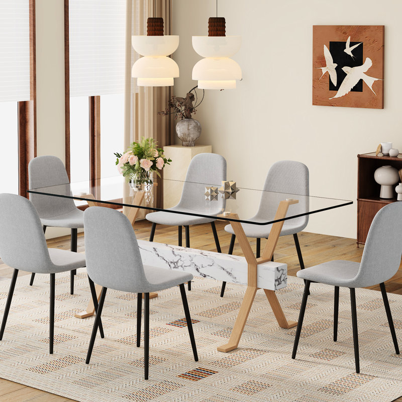 Table en verre transparent de 71 po x 35,4 po et 6 chaises en lin gris, confortable pour les réunions de famille avec un tissu simple et élégant
