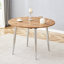 Table de salle à manger ronde extensible pour 4 à 6 personnes, panneau de fibres à densité moyenne à grain de bois brun avec pieds en métal argenté frais, transformation ovale peu encombrante-131256430