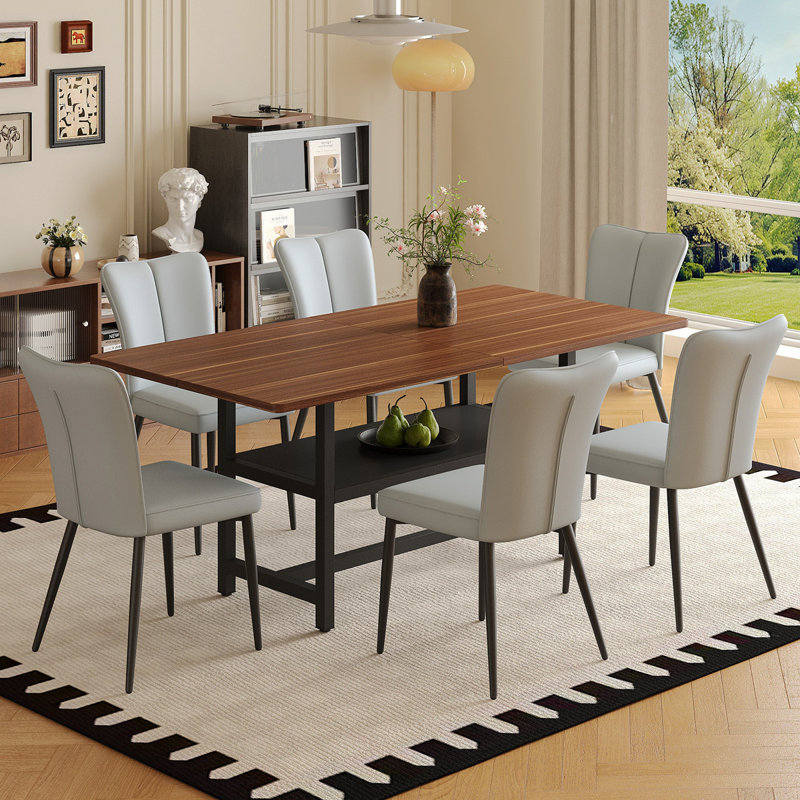 Ensemble de table et de chaises Table de salle à manger longue de 71 po en grain de noyer à la mode, un choix pratique pour ajouter de la couleur à la maison. Combinée avec 6 chaises en polyuréthane gris clair avec un motif à rayures verticales sur le dossier.