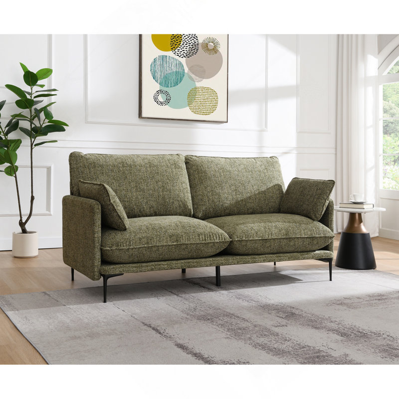 Canapé en tissu vert avec 2 coussins (coussin compressé)
