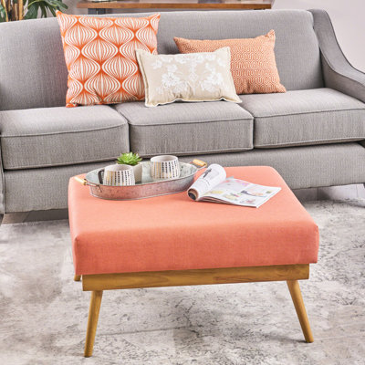 Mid-Century en tissu corail, offrant confort et fonctionnalité avec une fabrication confortable des pieds