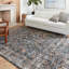 Tapis à motif floral bleu marine / orange Fiorillo-639821014