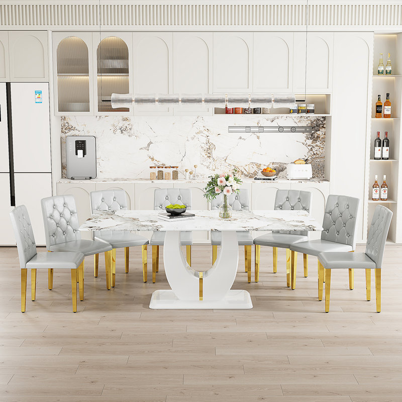 Ensemble de table de salle à manger rectangulaire de 71 po pour 8 personnes comprenant un plateau en faux marbre et des chaises en cuir de polyuréthane. Cet ensemble de salle à manger de 9 pièces convient aux maisons, aux restaurants et aux espaces de bureau.