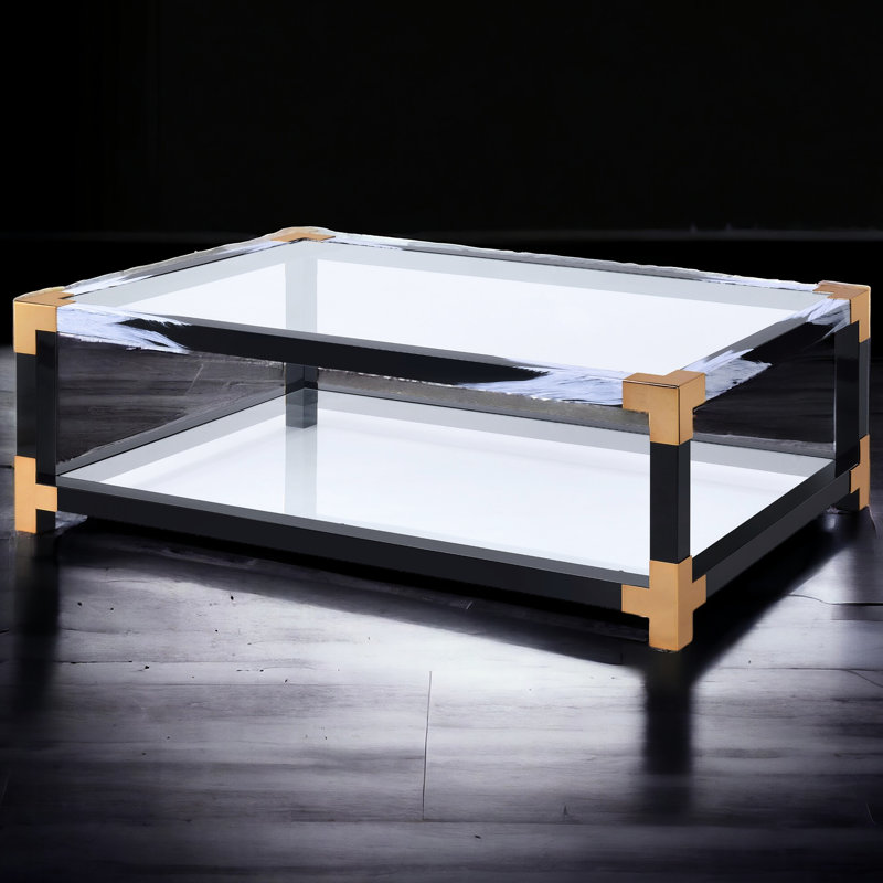 Table basse moderne avec pieds en métal et surface en verre transparent