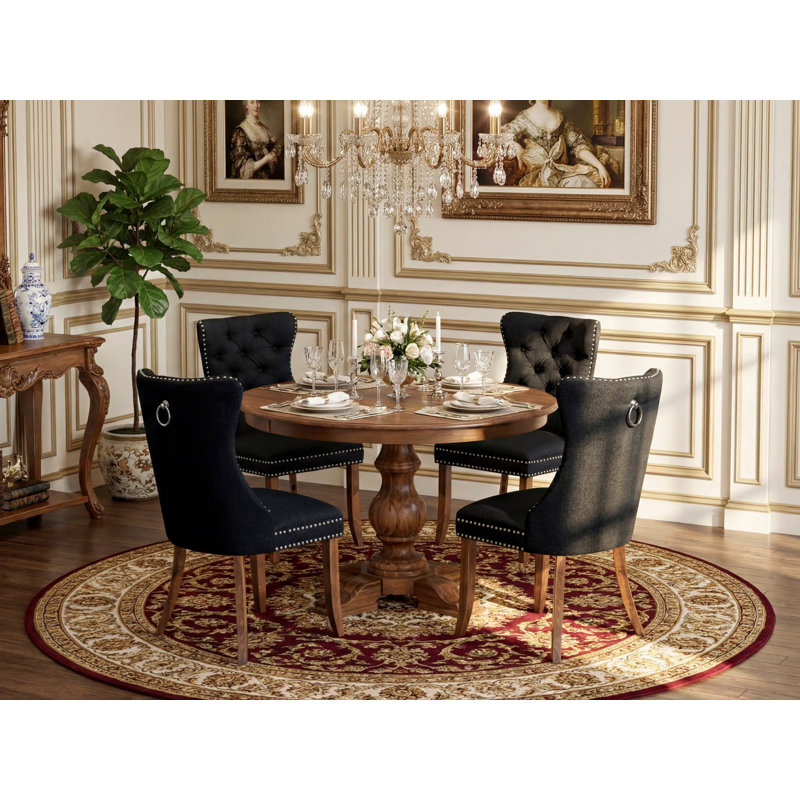 Ensemble de salle à manger 5 pièces en polyester avec 4 chaises rembourrées noires, dossier capitonné et table ronde de 48 po au fini noyer antique.