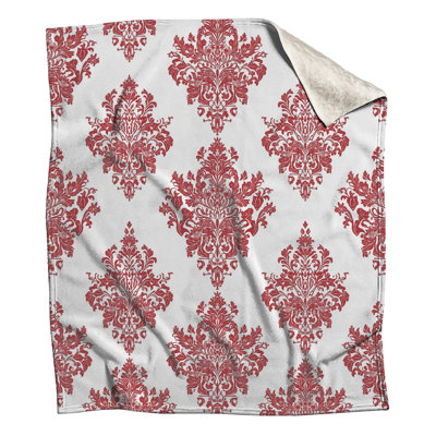 Couvertures à motif damassé rouge