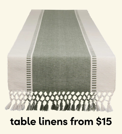 Sage green and cream striped table runner with knotted tassel fringe, table linens from $15.