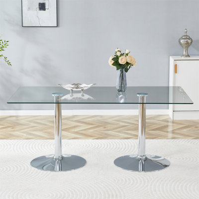 Un plateau de table en verre de 71 x 35,4 pouces et une table de salle à manger circulaire minimaliste moderne avec des pieds en métal argenté électrolytique. Convient aux restaurants et aux salons.