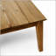 Table basse d'extérieur en bois d'acacia durable avec un design rustique et une finition résistante aux intempéries, parfaite pour le patio et le jardin