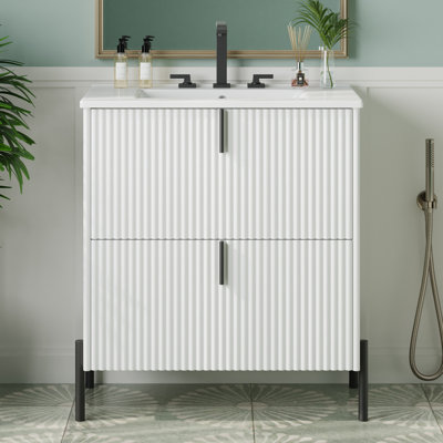 Meuble-lavabo autoportant avec lavabo en céramique intégré et conception cannelée, avec tiroirs à fermeture en douceur à extension complète