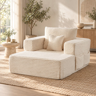 Fauteuil lounge modulaire surdimensionné Virelquessa en velours côtelé de 116 cm de large avec accoudoirs amovibles, poches de rangement et coussin décoratif