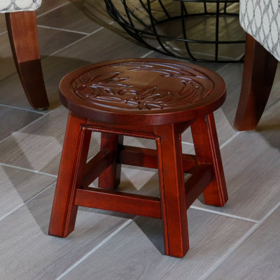 Escabeau sculpté en bois, motif floral cerise