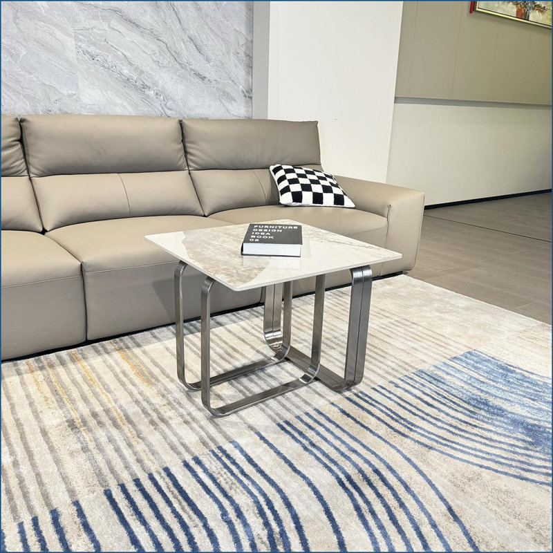Table basse de salon rectangulaire avec plateau en pierre frittée et structure en métal argenté, résistante aux égratignures et facile à nettoyer