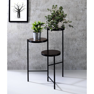 Présentoir à plante noir avec 3 compartiments ouverts finition florale en bois et rangement