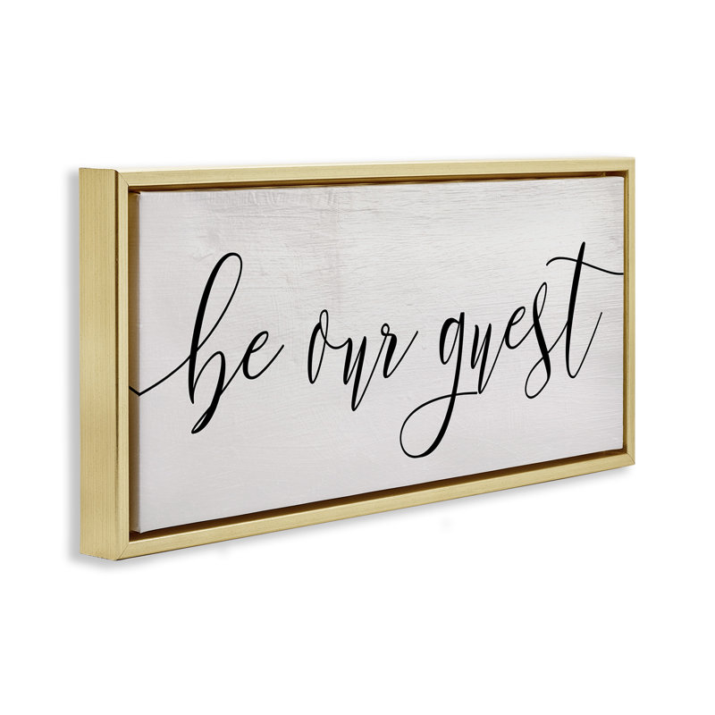 Be Our Guest Script Gold Framed Floater Canvas Wall Art by Daphne Polselli, 14" H x 31" W, Metallic Gold Floater Frame