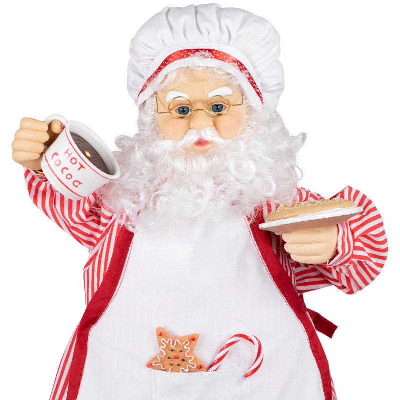 Chef avec figurine chocolat chaud et biscuit