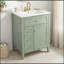 Meuble-lavabo vert clair 24 po avec lavabo en céramique et porte à fermeture en douceur pour un rangement efficace et une conception élégante