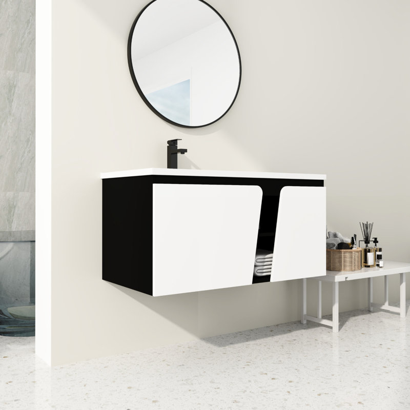 Meuble-lavabo de salle de bain avec lavabo en céramique et porte à fermeture en douceur. Fixé au mur. Apparence moderne. Rangement spacieux. Contreplaqué de qualité. Style blanc et noir. Couleur