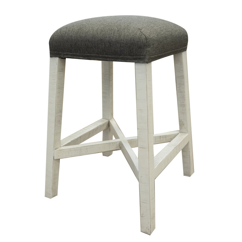 Tabouret en pierre avec assise en tissu et finition ivoire