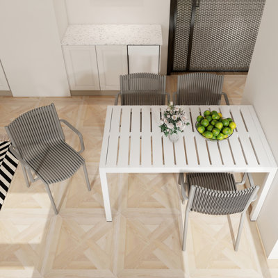 4Pcs Stackable Warm Grey Pp Armchairs And 55 Inch White Long Table - , , Zero Maintenance For Indoor/Outdoor Areas Modern All-Weather Durability, Lightweight Tabletop, Versatile Use