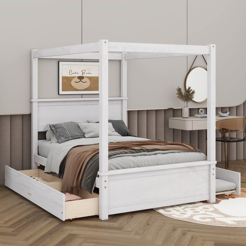 A Full-Sized Wooden Canopy Bed Equipped With 2 Drawers And Trundle