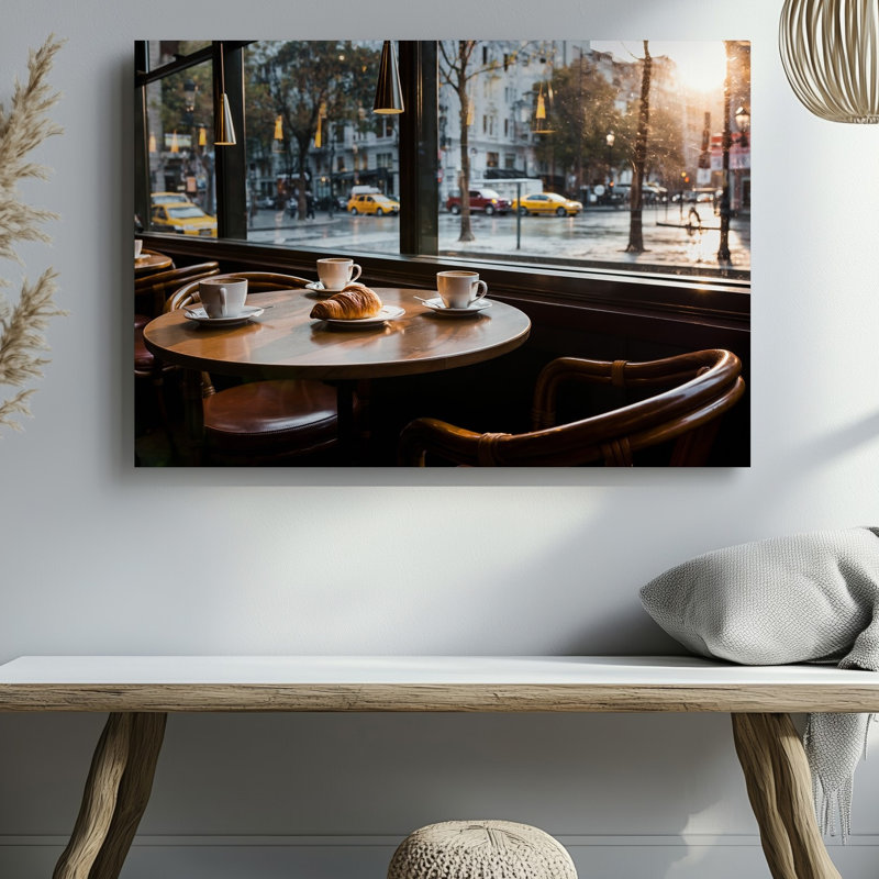 Toile, "A Cosy Caf Scene", capturée à partir d'un angle faible, avec art mural Une table ronde en bois ornée de trois tasses à café blanches, art mural