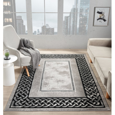 Tapis à bordure abstraite gris / noir de la collection Ksamil