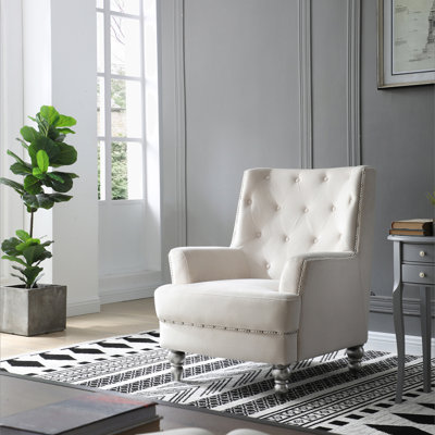 Charmant fauteuil traditionnel à accoudoirs ronds