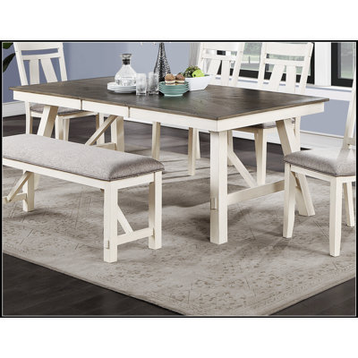 Table de salle à manger moderne extensible avec base blanche et plateau en bois gris, parfaite pour les sièges polyvalents.