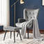 Fauteuil à oreilles et repose-pieds capitonnés-1653288150