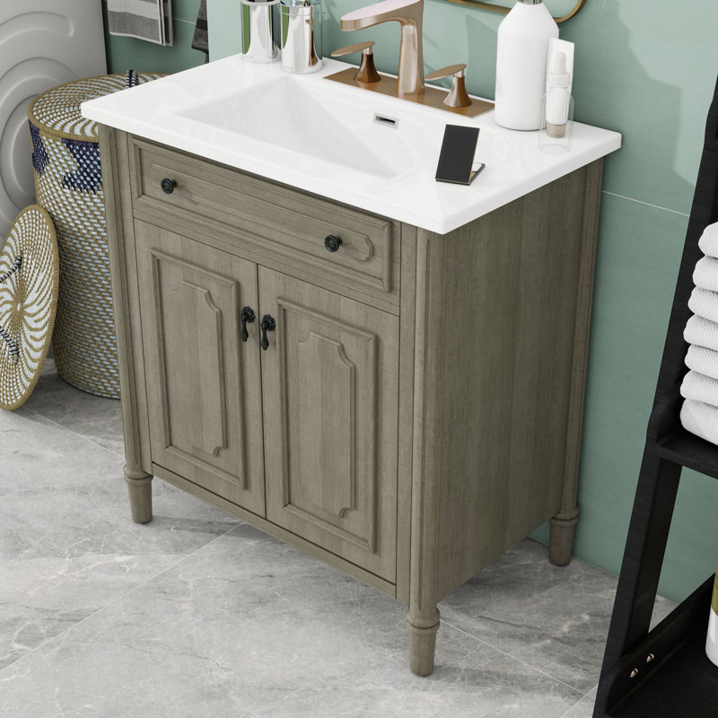 Meuble-lavabo autoportant élégant avec lavabo en céramique brillante, portes à fermeture douce et tablette réglable