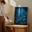 Toile, "Mystical Forest Scene Illuminated By Soft Ethereal Blue Bioluminescence", art mural parmi des feuilles surdimensionnées luxuriantes-760467169