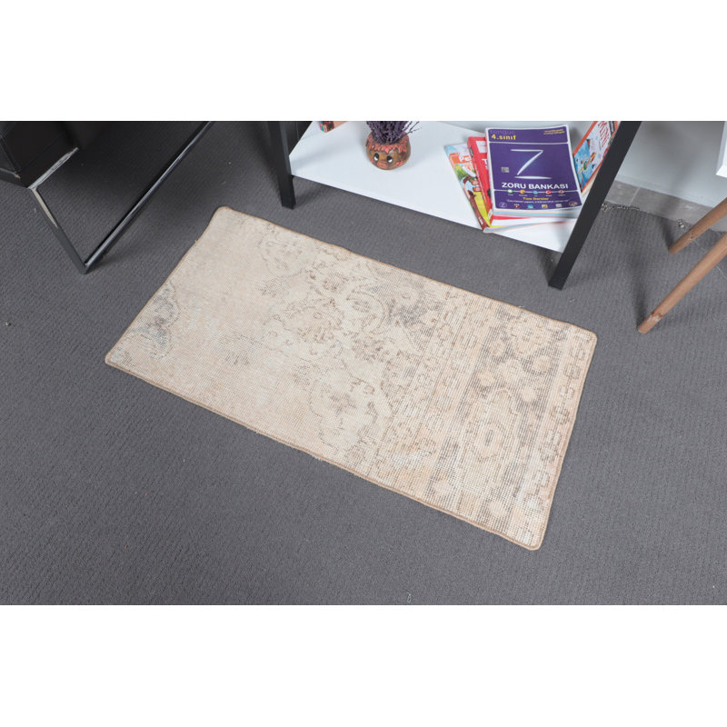 Small Beige Turkish Rug With Floral Design Perfect For Brightening Up Any Room