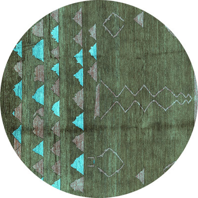Tapis turquoise / bleu en laine tissé à la machine Derrice