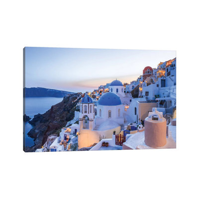Greece, Santorini, Oia. Sunset On Coastal Town. by Jaynes Gallery - Wrapped Canvas Print