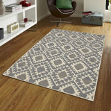 Tapis moderne à motif de losanges crème et sable