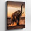 Toile, un majestueux éléphant se dresse fièrement dans un vaste paysage aride au coucher du soleil-2007298567