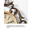Horloge murale rétro en laiton avec cadre floral de style antique
