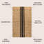 Tapis en jute rayé naturel / noir à motif rayé Olivier-1736833512