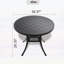 Table de salle à manger en fonte d'aluminium avec texture sculptée élégante et cadre noir résistant aux intempéries pour une utilisation extérieure