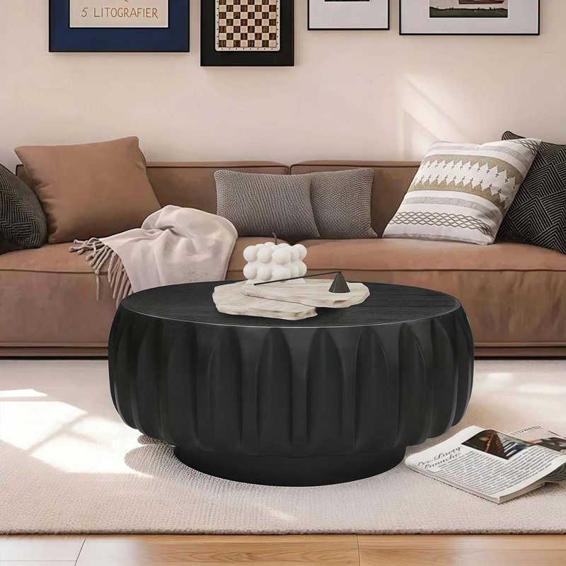 Table basse ronde en bois massif sculpté au design sculptural élégant, Noir