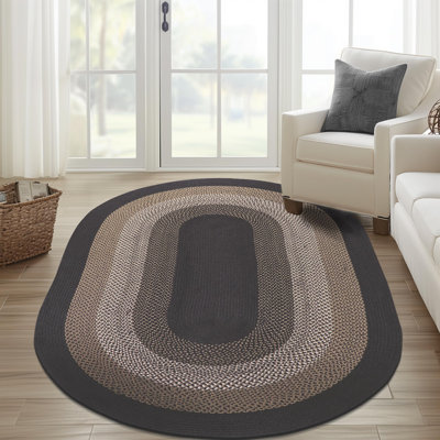 Tapis gris anthracite / brun / blanc tressé à la main Enika