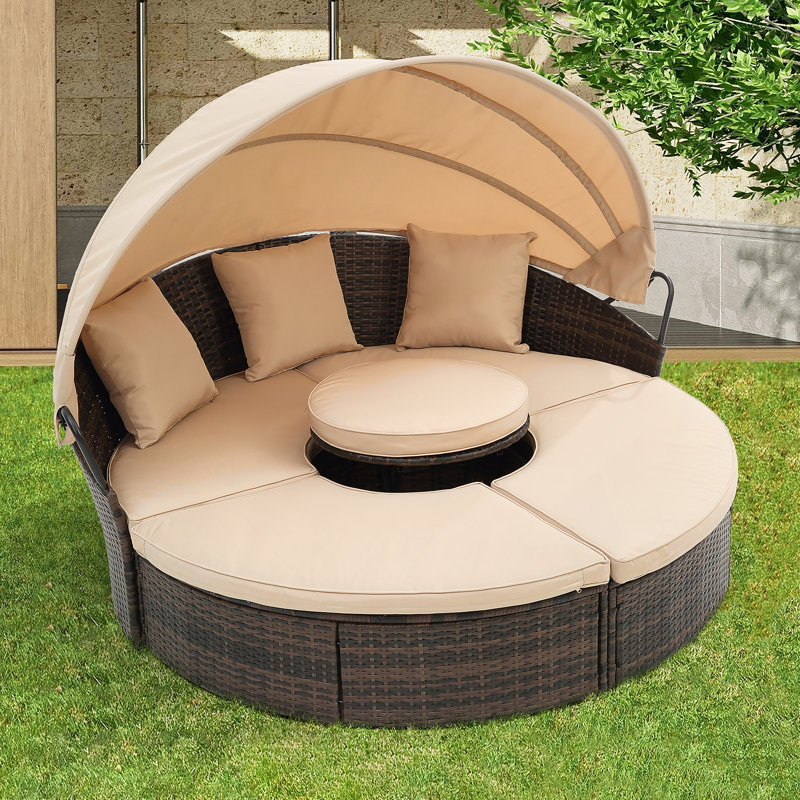 Canapé-lit d'extérieur rond en rotin avec auvent et table basse relevable