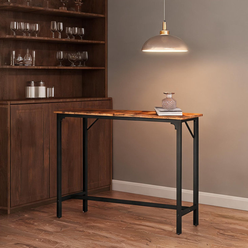 Recevez vos invités avec style grâce à cette table de bar compacte de 109 cm (43 pouces), dotée d'une élégante finition brune et d'une structure en fer robuste, supportant jusqu'à 95 kg (209 lb).