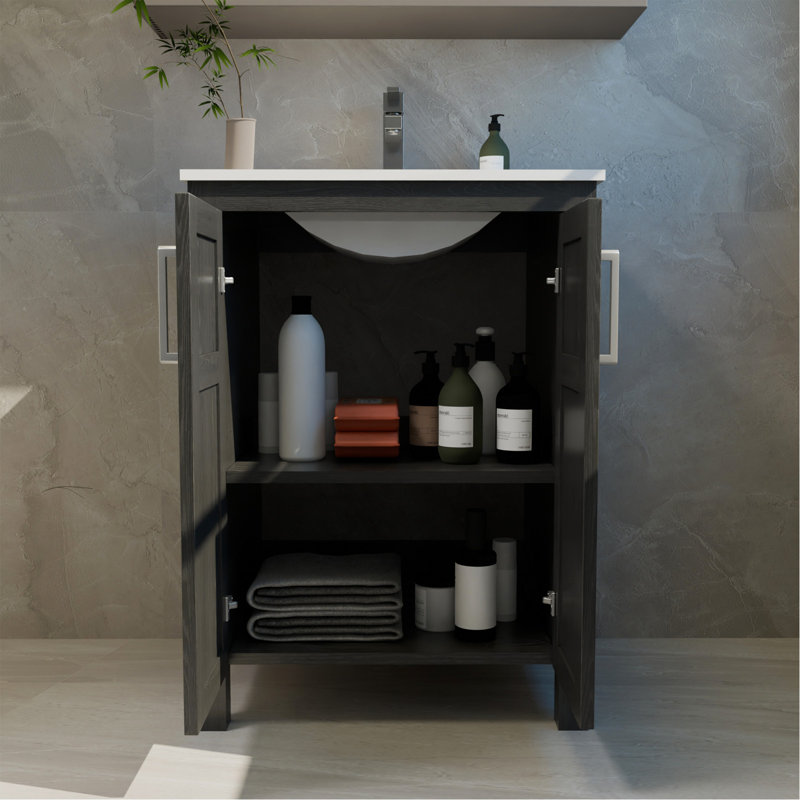 Une armoire de salle de bain noire de 24 pouces, jumelée à un lavabo en céramique blanche, présente un design moderne et est faite de matériaux imperméables et durables.