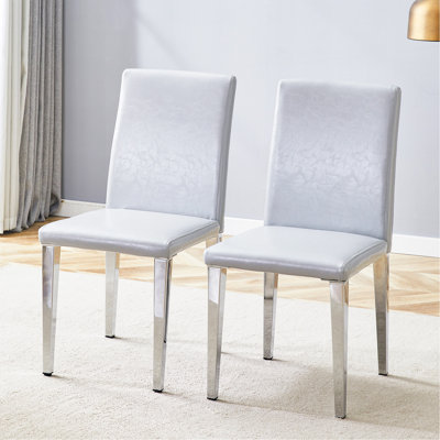 Deux chaises de salle à manger en polyuréthane gris clair (seulement les chaises)